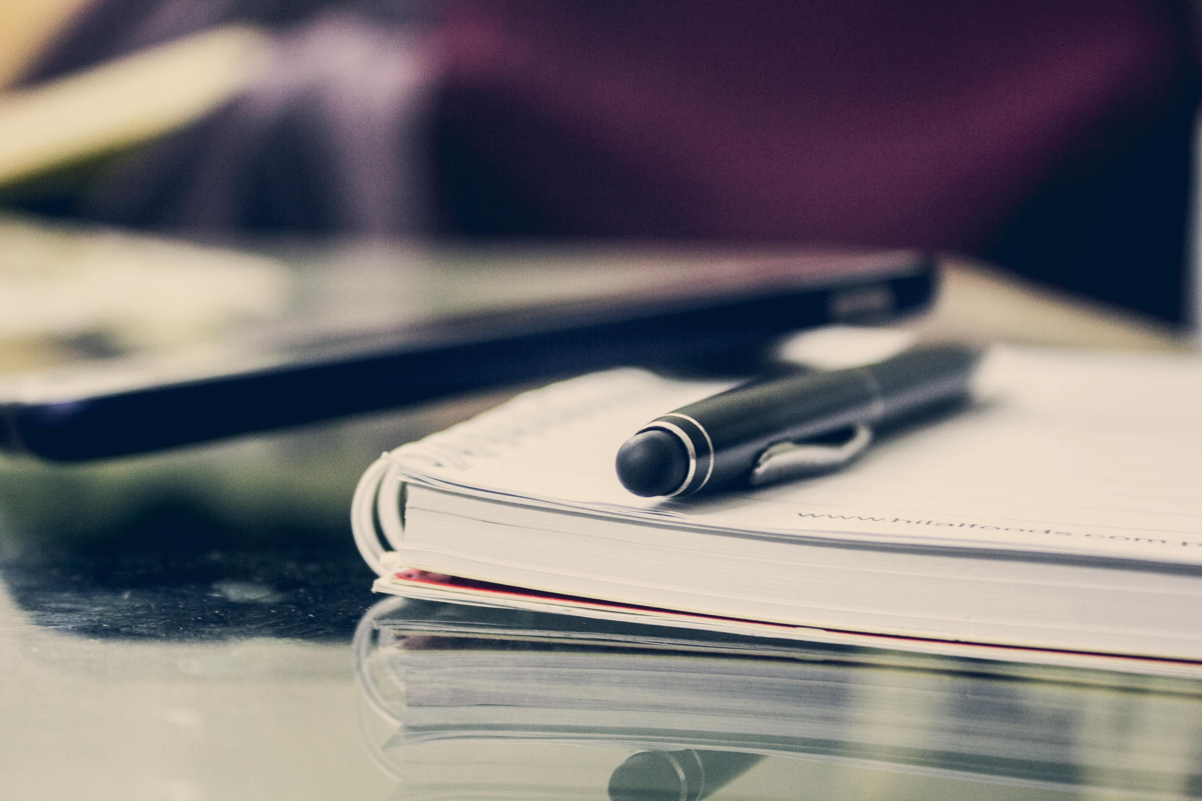 Pen on a book on a desk